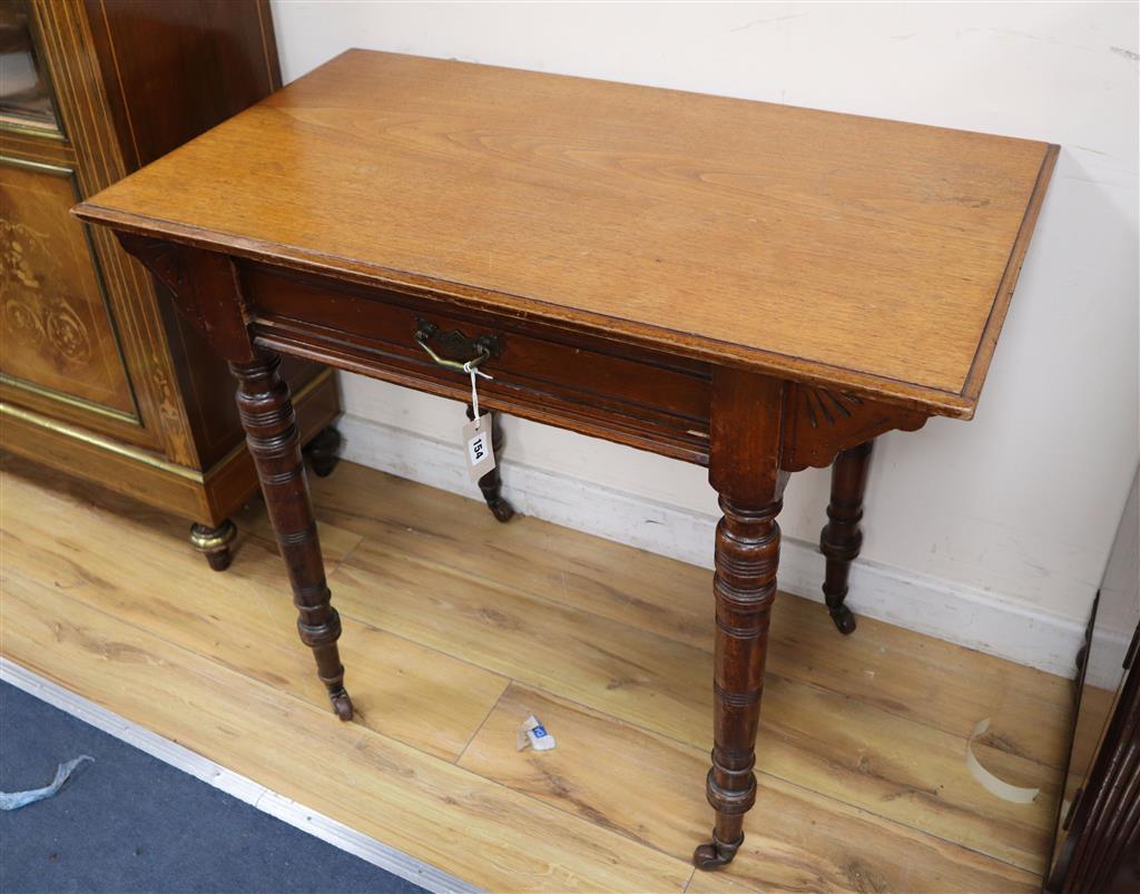 A late Victorian aesthetic movement walnut side table, width 91cm, depth 52cm, height 75cm
